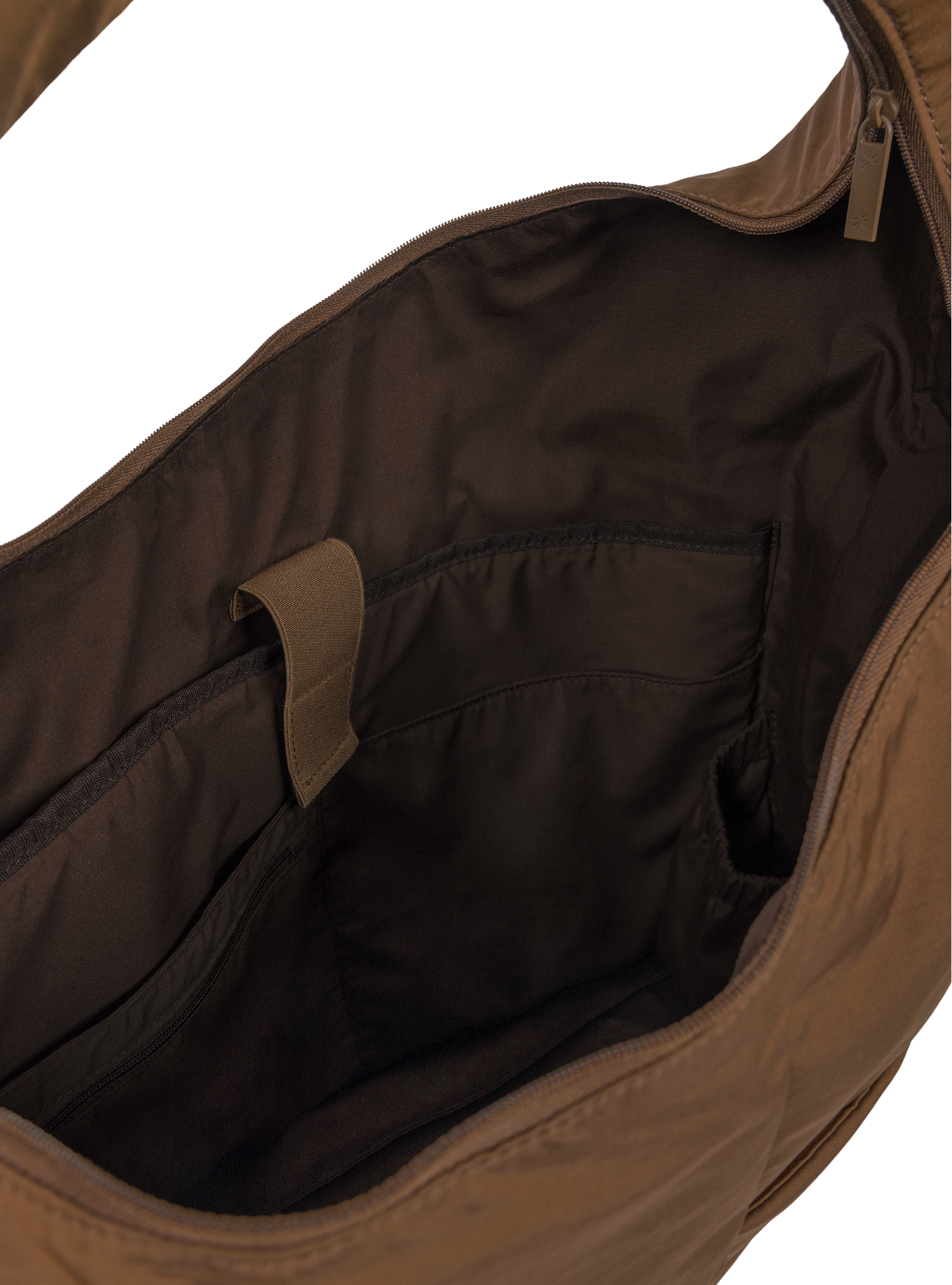 Interior of the Arc hobo-style bag in chocolate brown nylon, with laptop compartment