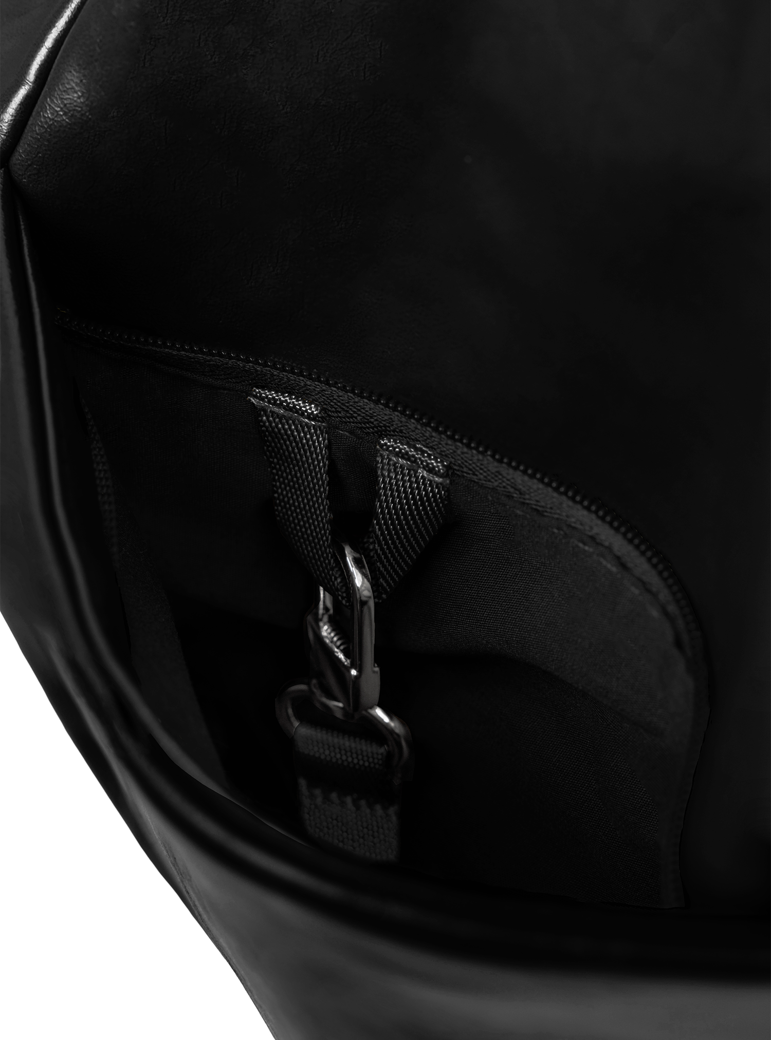 Exterior pocket of the Midi Arc hobo-style bag in black vegan leather, with concealed snap loop