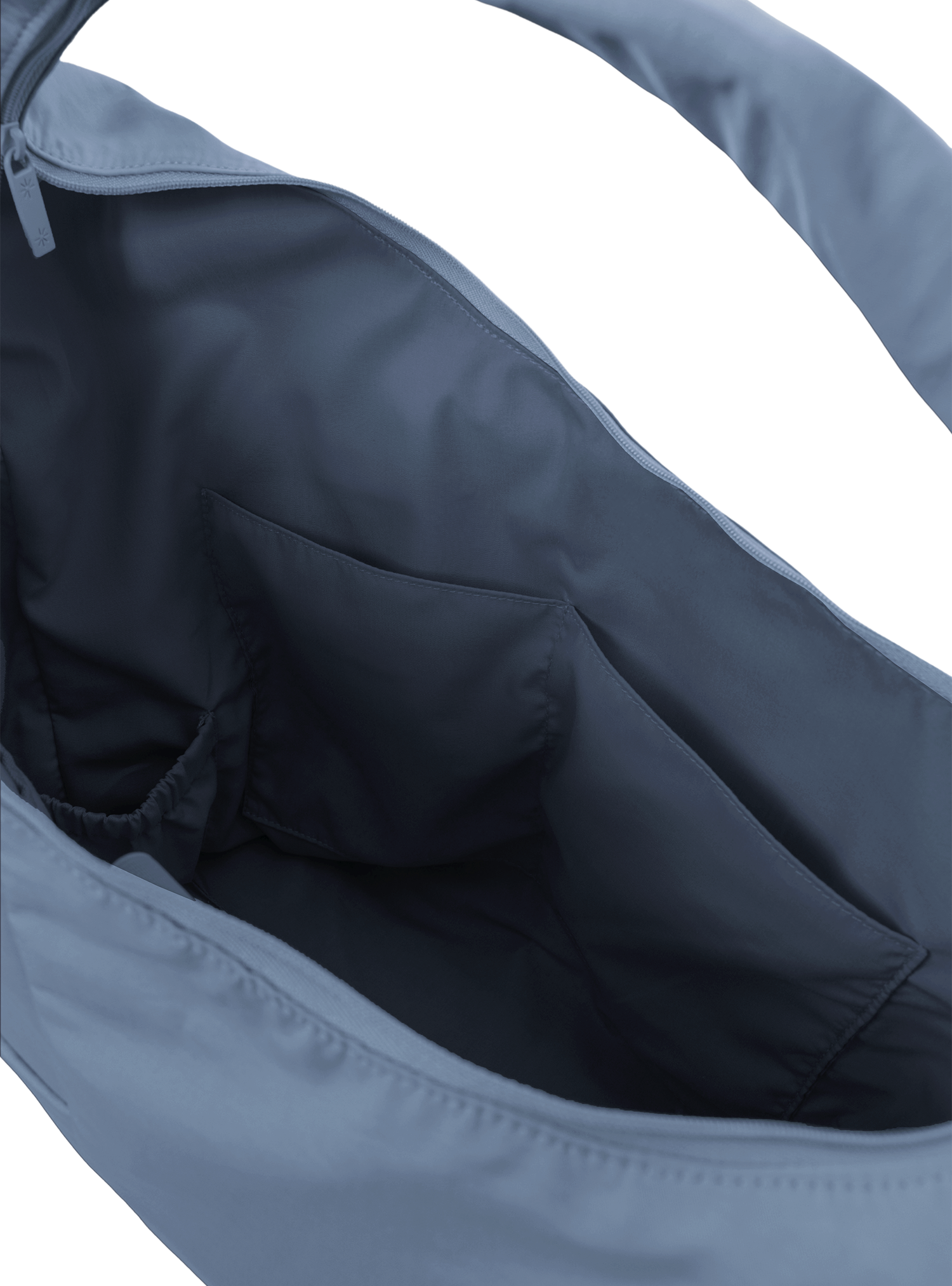 Interior of the Arc hobo-style bag in grey blue nylon, with multiple pockets and a bottle holder