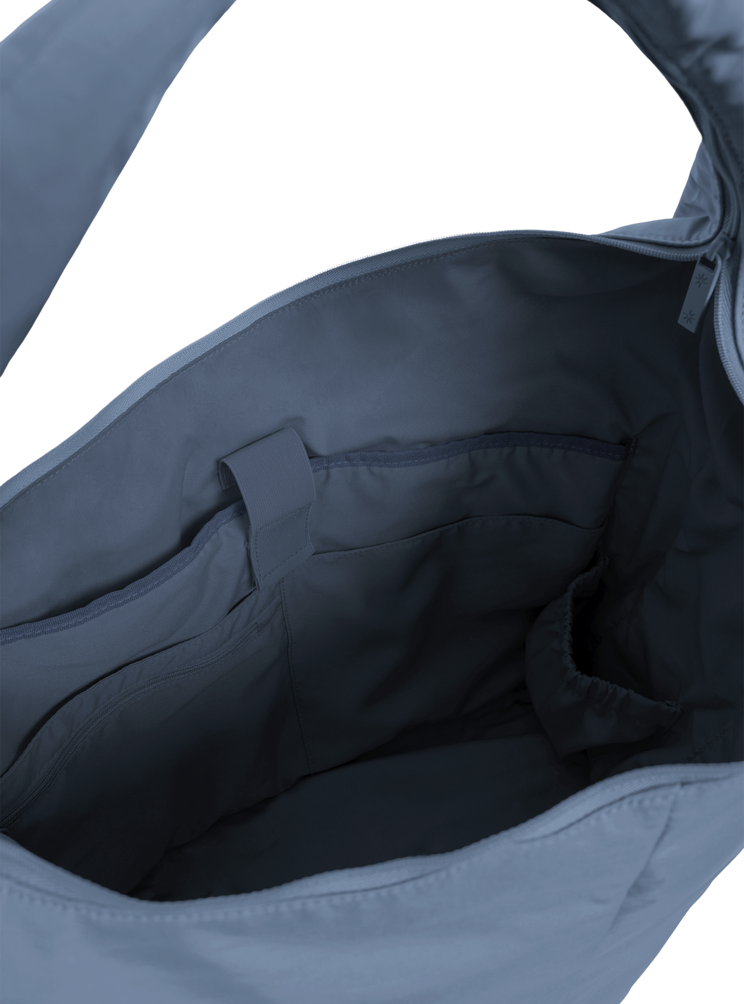 Interior of the Arc hobo-style bag in grey blue nylon, with laptop compartment